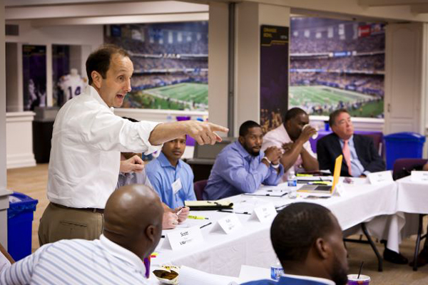 Professor points to student.