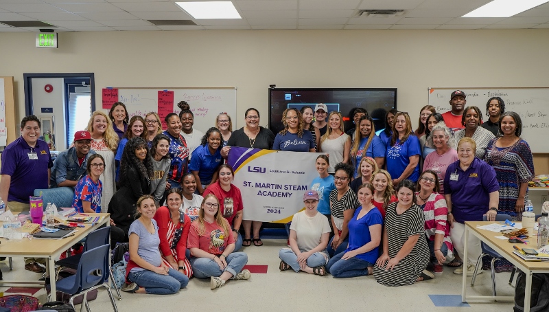 new-member-school school staff holding louisiana aplus banner