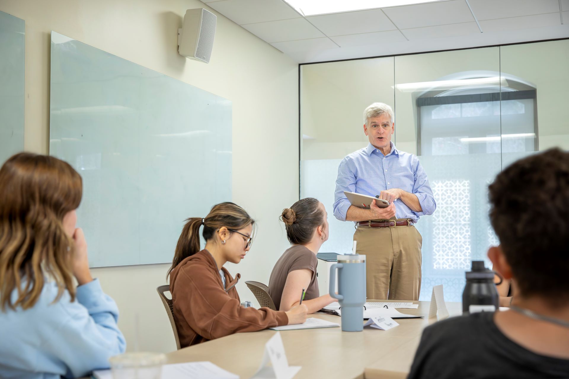 A photo of US Senator Bill Cassidy teaching an honors seminar in the French House in 2023.