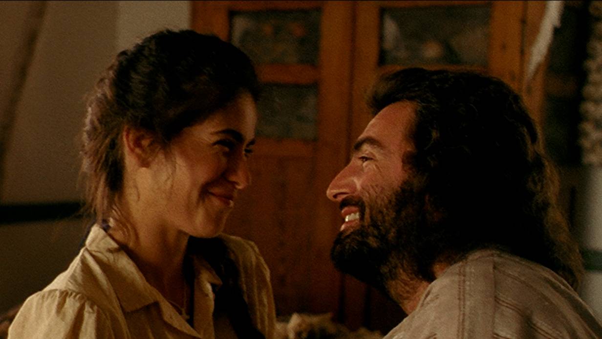 Belizaire Still A still image from the movie Belizaire the Cajun. Belizaire and Alida look at eachother tenderly.