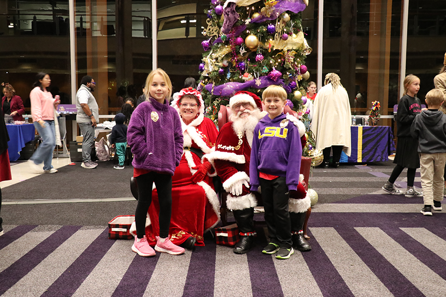 children with Santa and Mrs. Claus