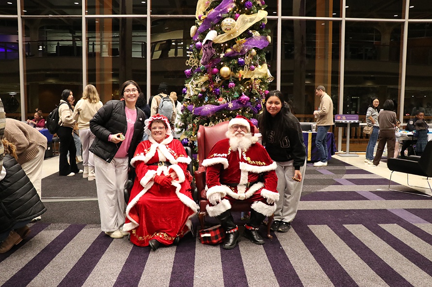 staff with Santa and Mrs. Claus