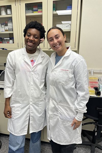two undergrads in white coats